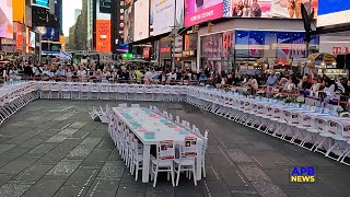 Thousands View Empty Shabbat Table in Times Square Set for the 224 Hostages