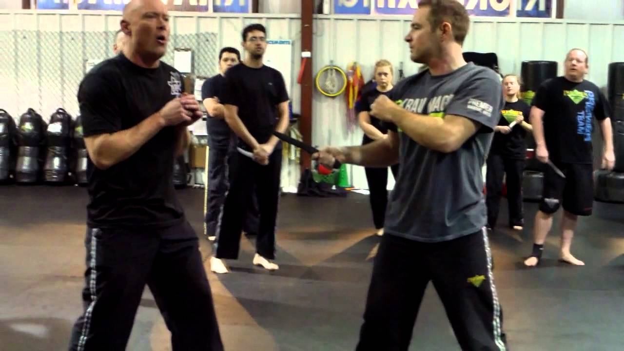 Stop Kick to Knee with retreat step to create distance from a knife attacker