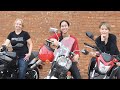 Three girls riding through country roads