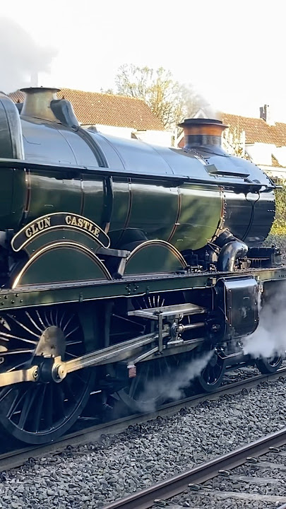 Clun Castle eases away from the station - UK steam trains