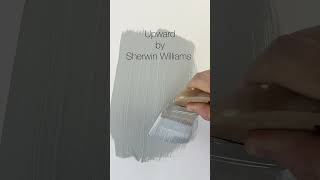 Upward by Sherwin Williams is a soft serene pale blue paint color with gray undertones.