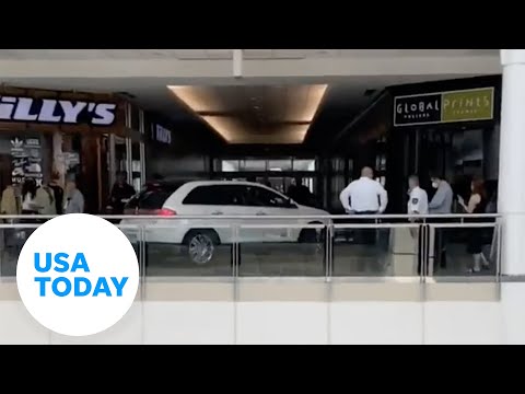 Elderly woman drives car onto second floor of mall, escorted out | USA TODAY