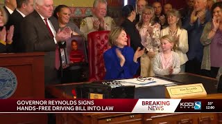 Iowa Gov. Kim Reynolds signs hands-free driving bill into law