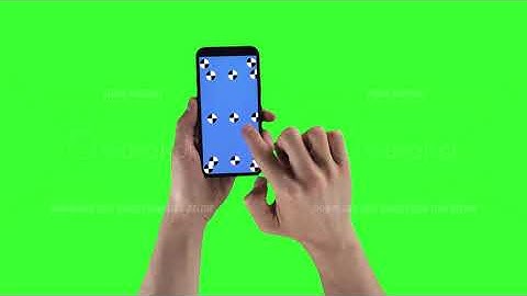 Man is zooming content on smartphone with tracking markers on display against green screen