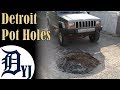 Incredible Detroit pot holes swallow cars whole! Unless your a jeep