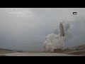 Japan space agency's experimental reusable rocket hovers and lands safely in first test flight