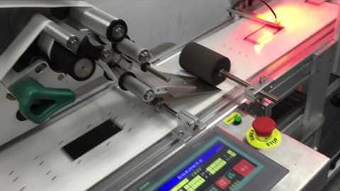 Hang tag paging and labeling machine