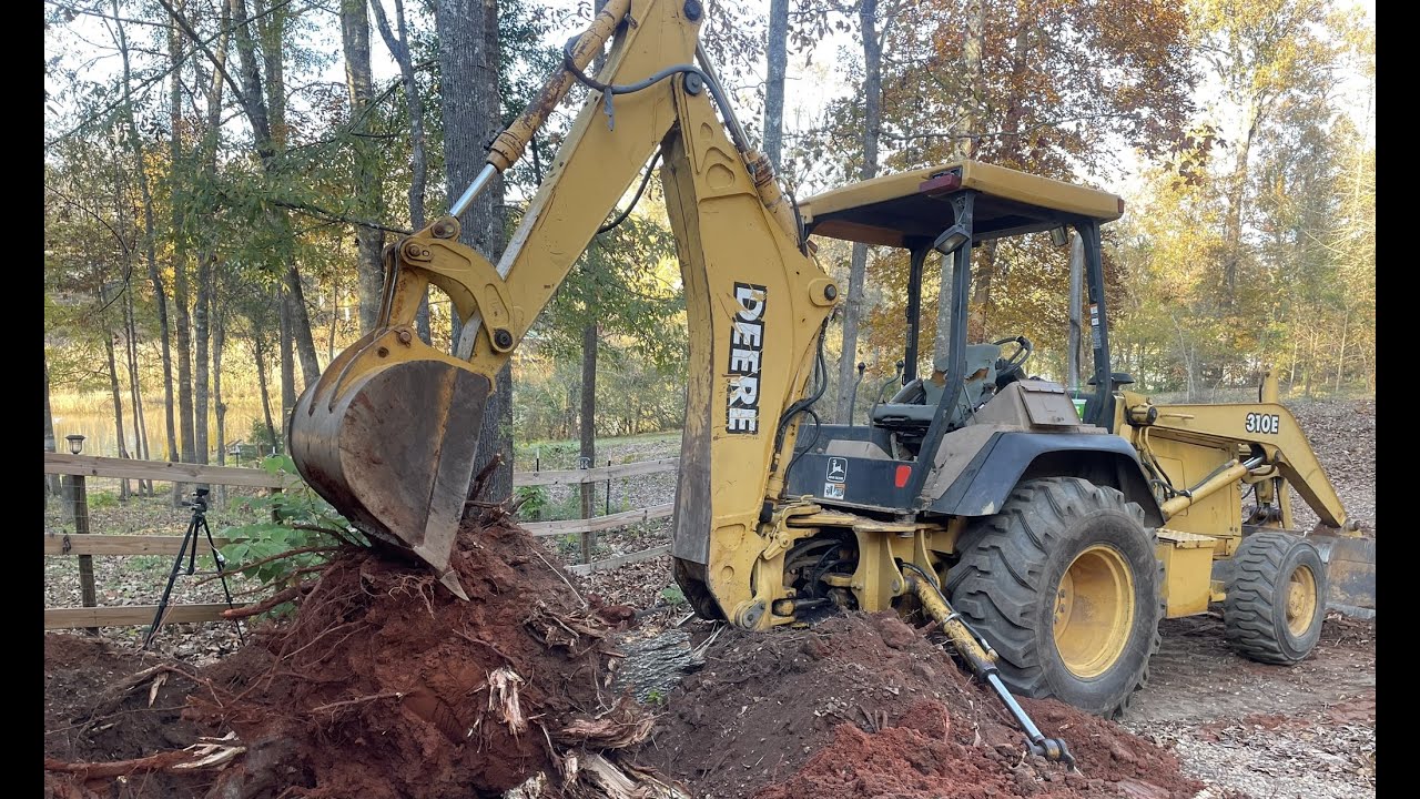 DIGGING BIG STUMPS WITH JOHN DEERE 310E BACKHOE