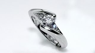 Handmade 18 kt white gold solitaire diamond ring with side diamonds