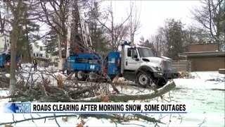 Roads clearing after morning snow, some outages