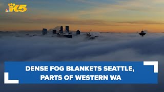 Dense fog rolls into western Washington, covering Seattle on Dec. 20