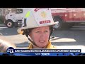 Car-hauling truck slams into apartment building in Panorama City