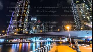 Walk on promenade of Dubai Marina with view of Towers and canal in Dubai night timelapse hyperlapse