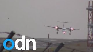 Incredible footage shows pilots fighting against winds as planes struggle to land in storms