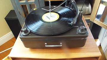 Zenith 4 speed automatic record changer playing an LP record.