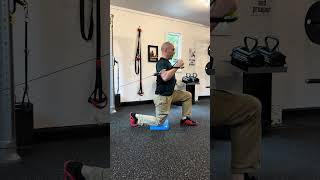 Half Kneeling One Arm Cable Shoulder Press Side View