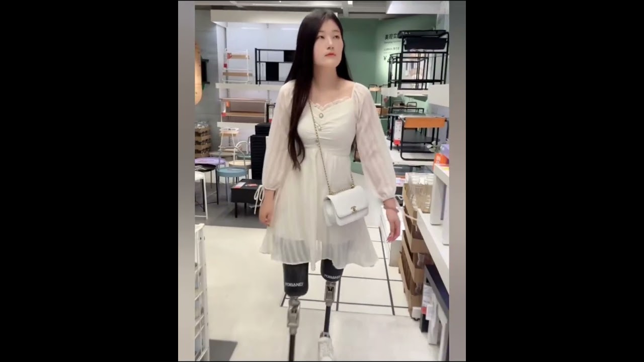 The beautiful woman is an amputee and lives in prosthetic limbs 