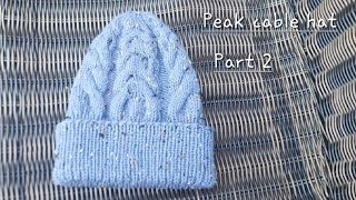 Continental knitting. Peak cable hat. Decreasing, waving ends. Part 2.