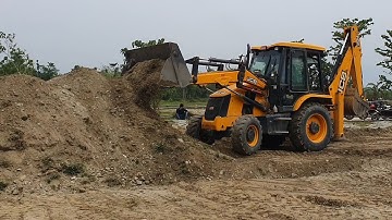 Collecting Dirt and Clearing Land To Plant Tree By JCB Backhoe