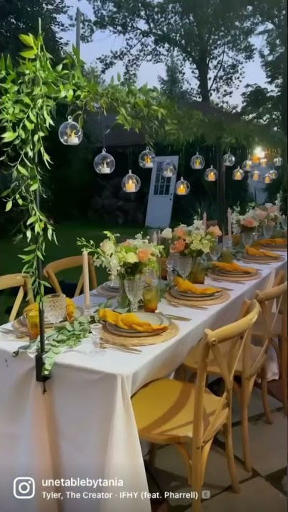 Dinner party table setup. Tablescape in the backyard.