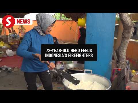 Volunteers feed firefighters battling wildfires in Indonesia's Central Kalimantan