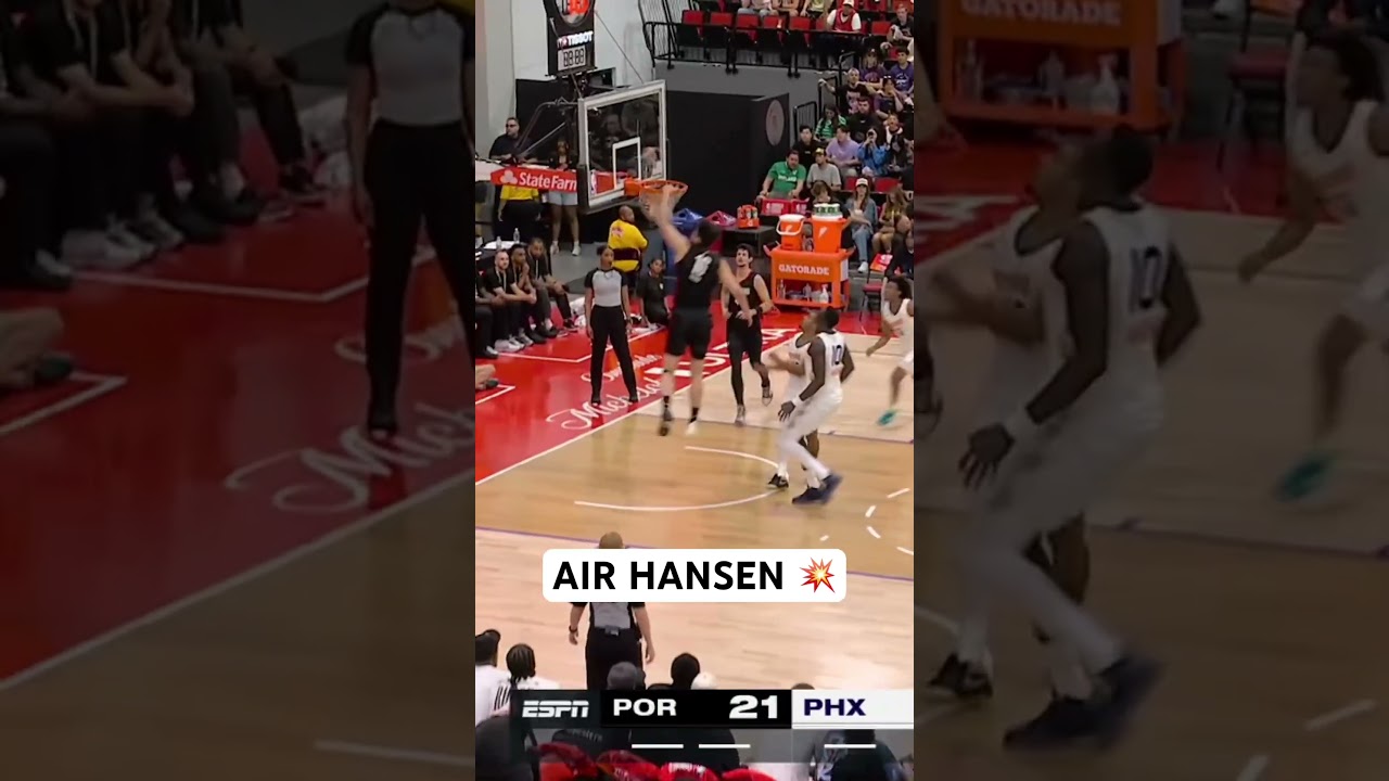 Yang Hansen attacks the paint and rattles the rim with the one hand slam