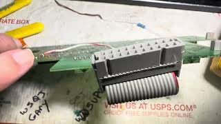 RACAL RA-6778C repaired an open trace from 144051 mux chip to ribbon cable connector. Fixed Testing