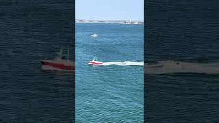 Disabled boat being towed