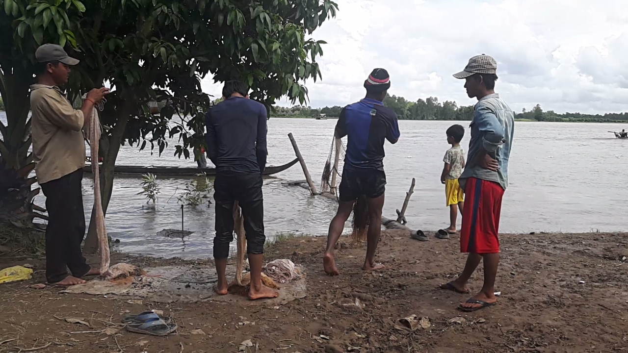 Villagers Do Fishing On The River Bank In Kandal Province