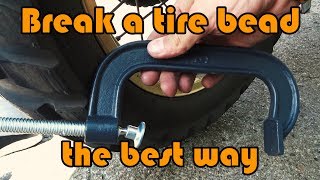 The best way to break a tire bead during motorcycle adventure  using only c clamp