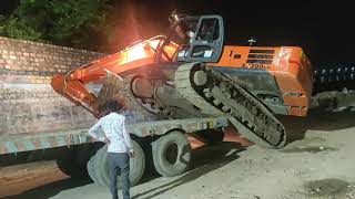 TATA Hitachi excavator loading Trailer screenshot 1