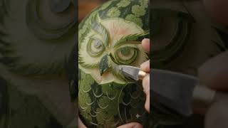 Carving an owl face into a watermelon 🦉🍉