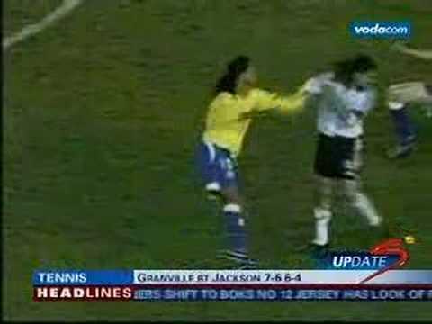 Ronaldinho slaps Sorin for nutmegging him.