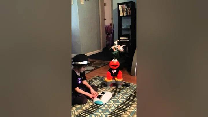 4 year old rockstar plays guitar behind her head