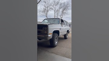 Restored Chevy Blazer Classic 4x4 driving out of the shop