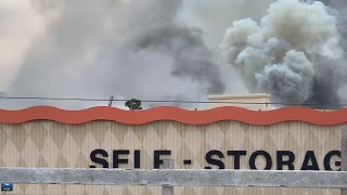Traffic blocked on parts of Kostoryz, SPID as crews respond to fire at U-Haul storage facility