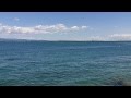 2 minutes of sitting on a rock at lago di garda  lake of garda desenzano italy