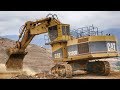 Caterpillar 5130B Excavator Loading Trucks