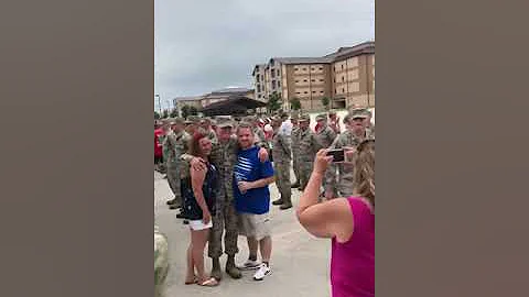 Airman graduate salutes Officer mom