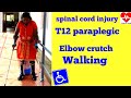 Spinal cord injury T12 paraplegic walking with elbow crutches