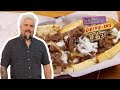 Guy Fieri Eats a Cheesesteak on HOMEMADE Bread | Diners, Drive-Ins and Dives | Food Network