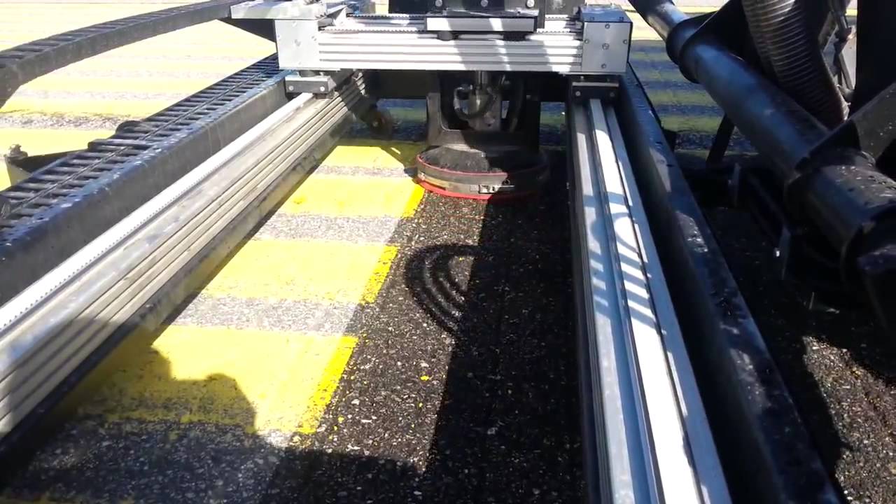 Paint marking removal using high pressure water