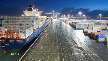 Time lapse of container ship arriving and being unloaded