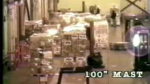 Robot stretch wrapper working in warehouse wrapping pallets