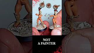 SCULPTOR PAINTS MINIATURES