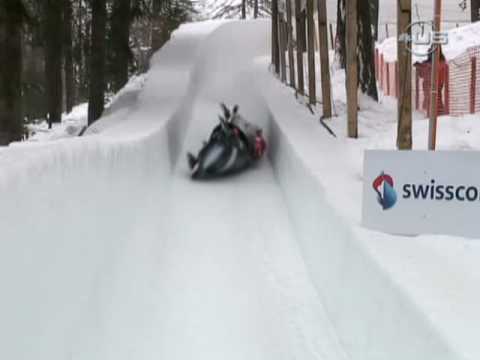 2009, St. Moritz, Switzerland, FIBT World Cup Four Man Bobsled, Juergen Loacker and team have a little trouble and have to brace for the ride down the track at 105 kph on their side, after they crash. (Universal Sports, UniversalSports.com)