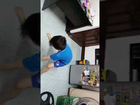 6 year old boy tries to do a split.