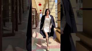Rika SAK amputee in white suit, crutches, heels and stockings