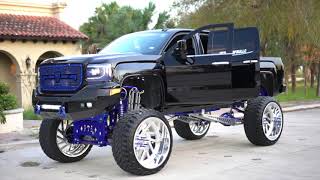 2019 GMC Denali 1500 on HUGE 30 inch wheels with a 17 inch Coil over lift kit