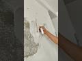 Smoothing and Repairing Wall Surface Using a Hand Trowel for an Even Finish #shorts